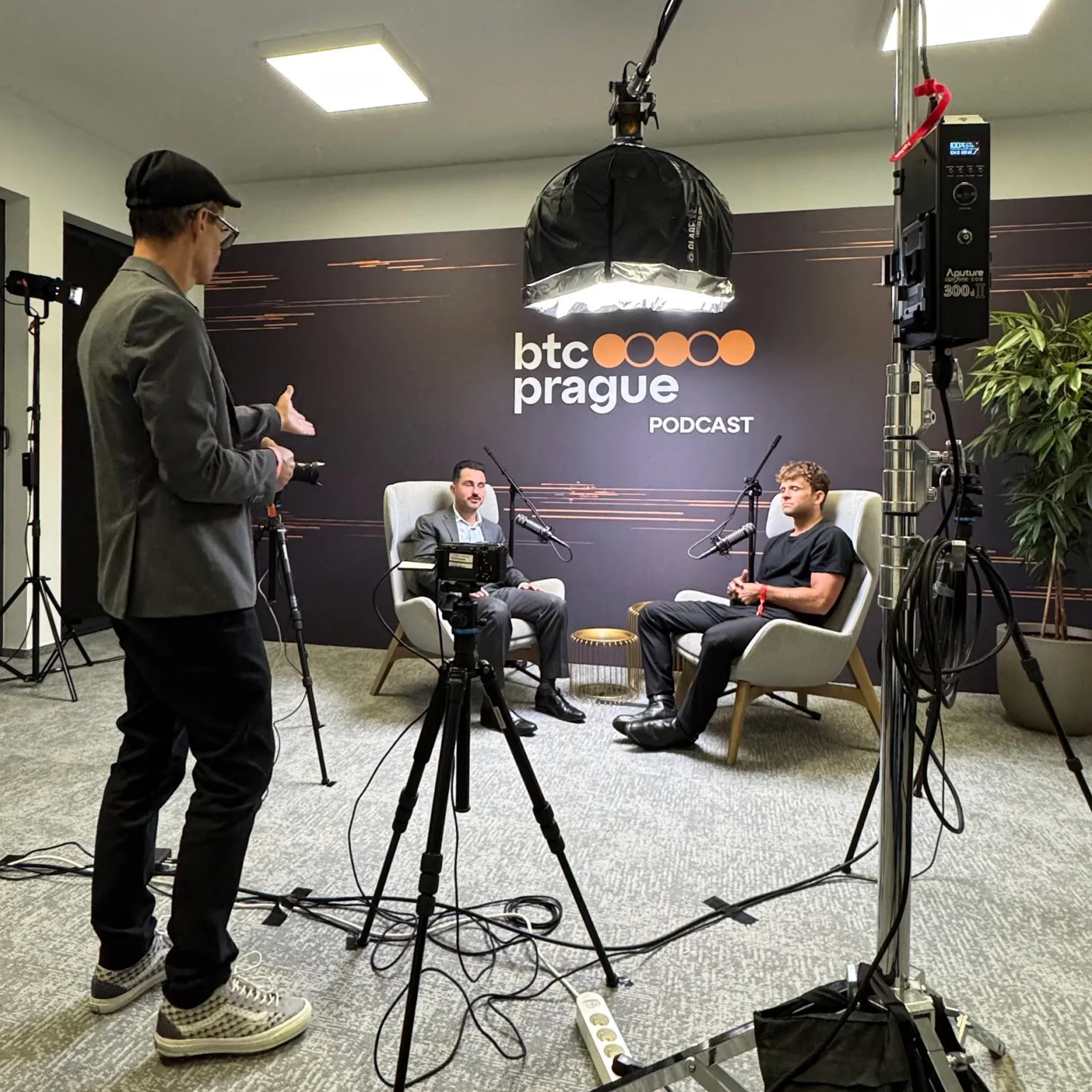 Two people smiling in a BTC Prague lounge area